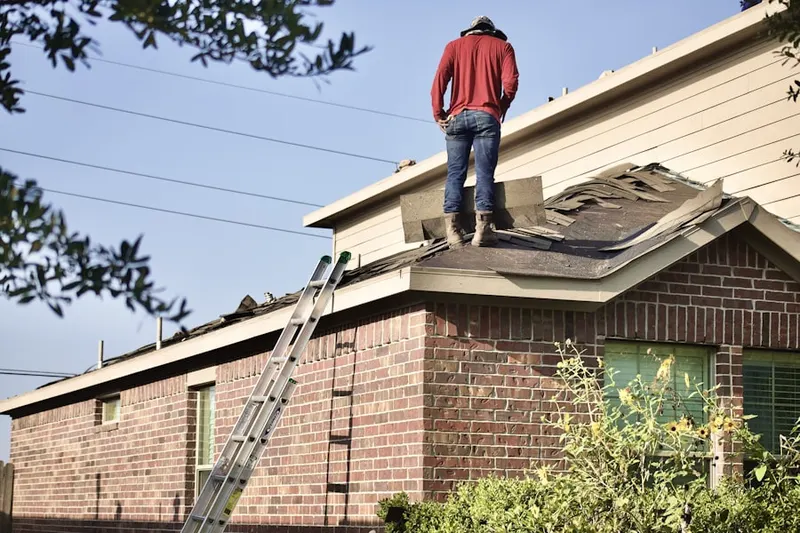 Professional roofer working on a residential roof in Tiburon